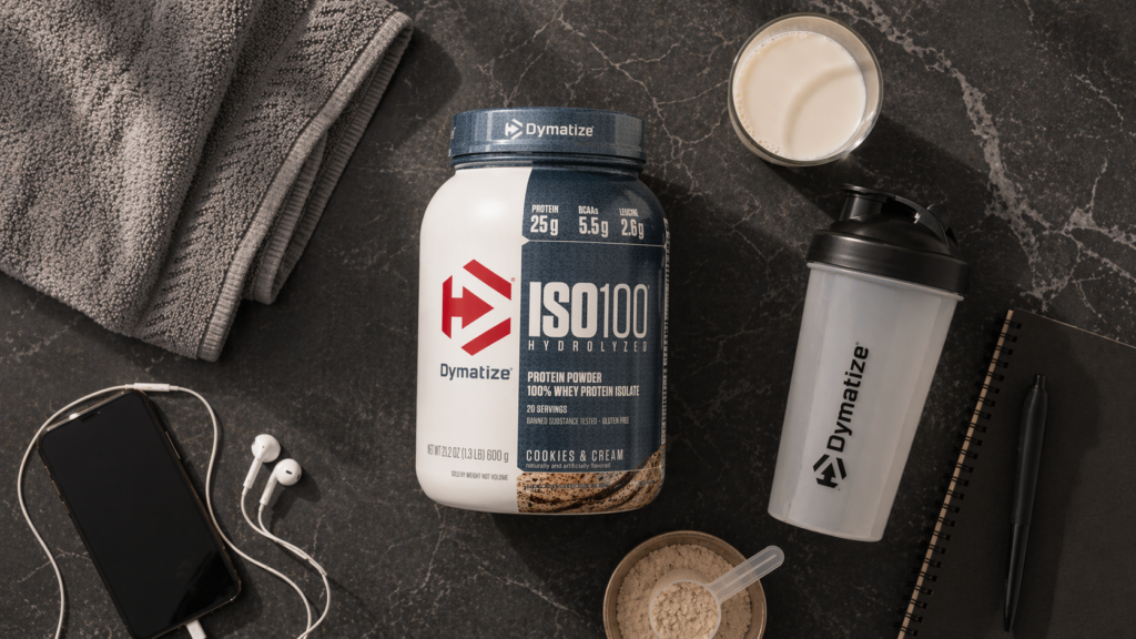 dymatize iso100 protein shakes worth it lifestyle flat lay with shaker and milk