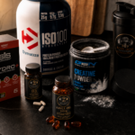 supplements worth taking arranged on a dark kitchen counter